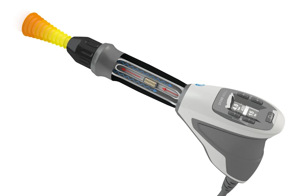 Cutaway diagram of a radial shockwave handpiece showing the pressure wave spreading out from the applicator